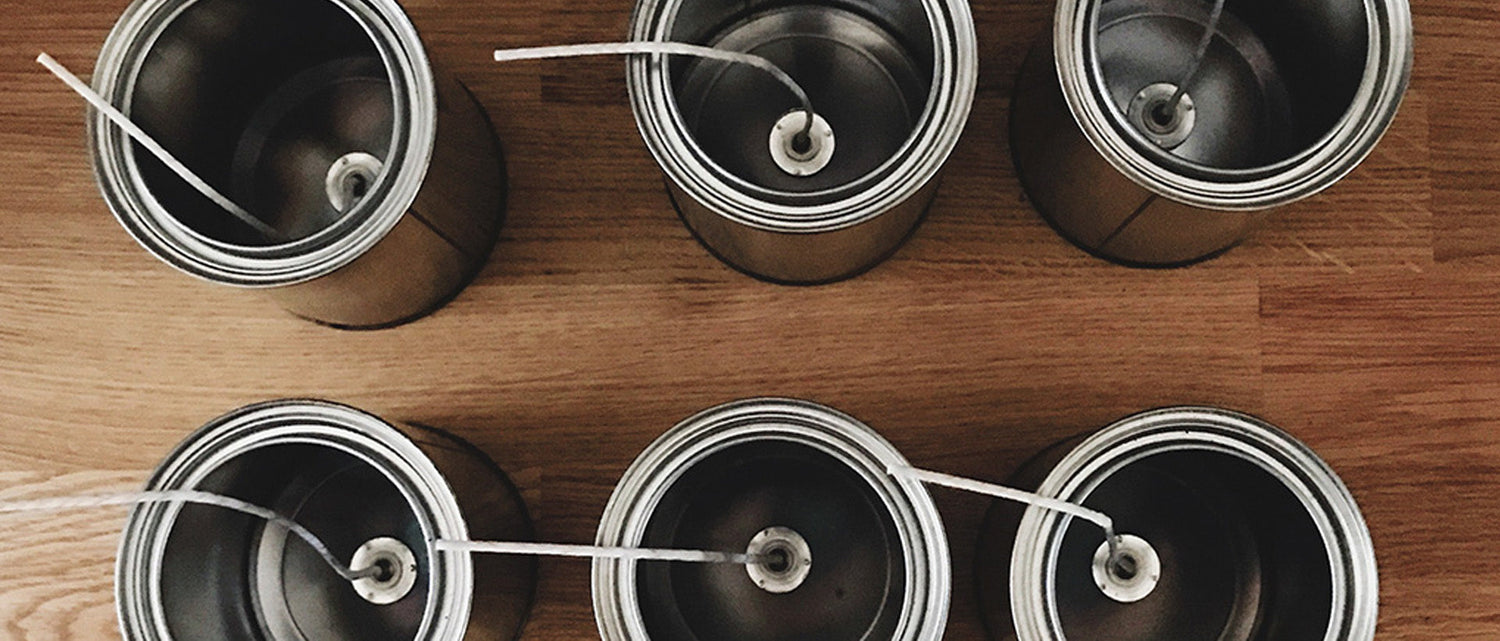 Shoppe 815 Candle Tins with wicks in them before candles are poured