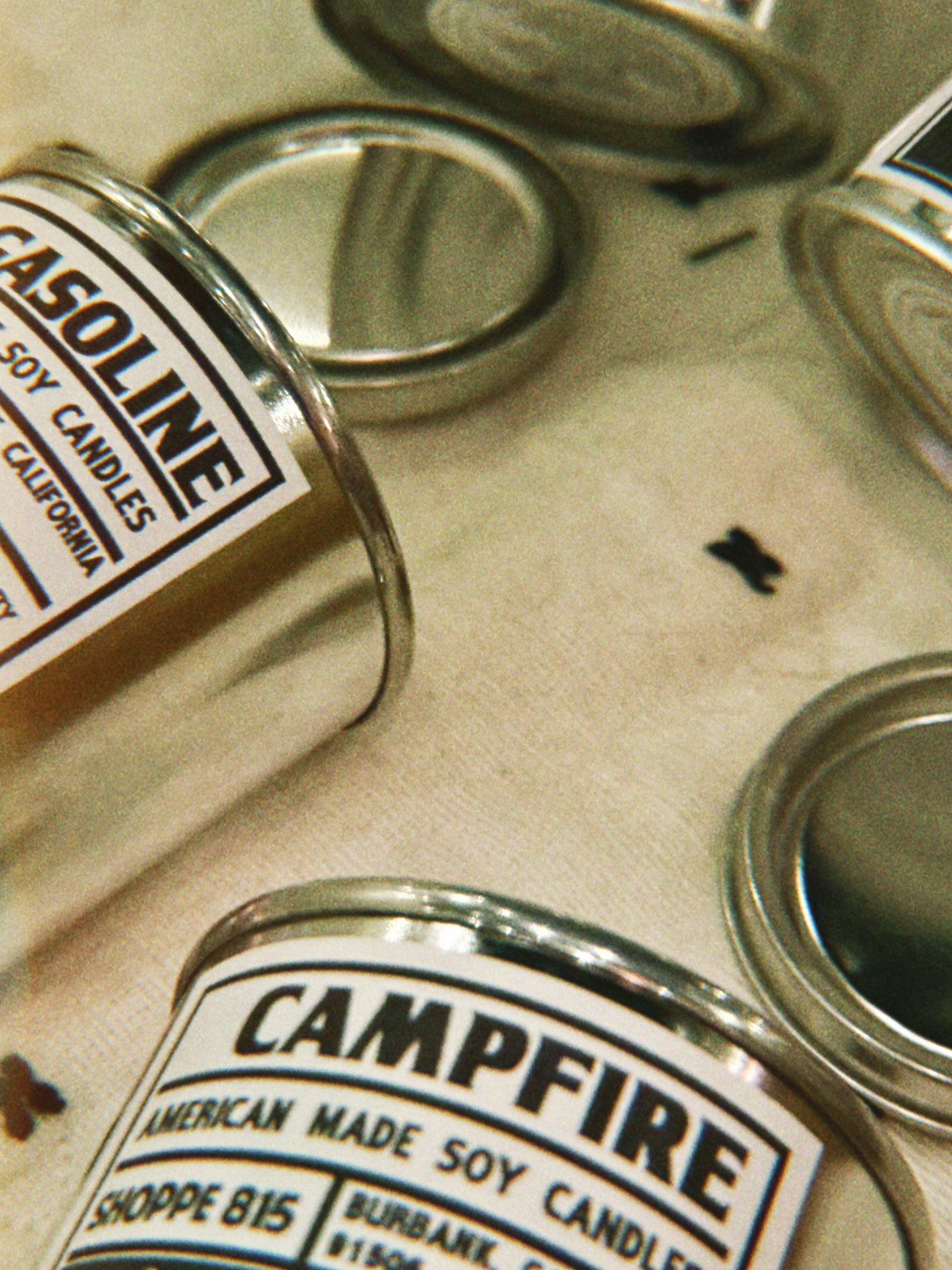 Zoomed in photo of gasoline and campfire votive candle labels