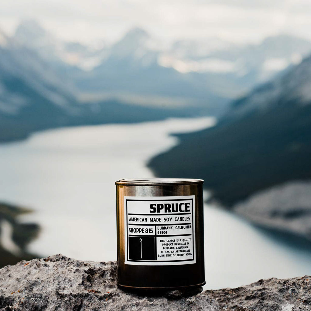 Spruce tin candle overlooking an unforgettable mountain view creating memories you'll enjoy for life!